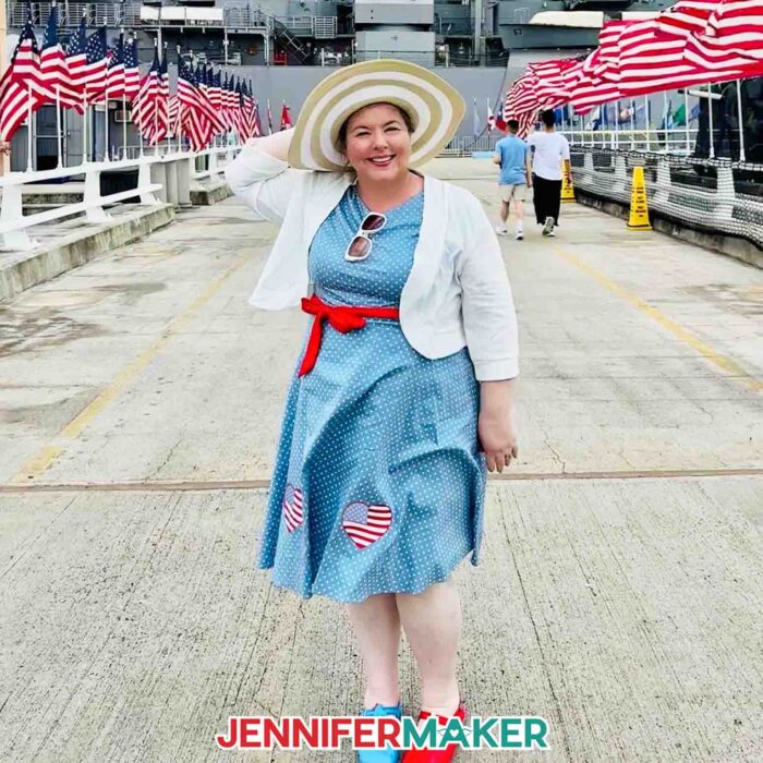 Jennifer Maker at the Pearl Harbor memorial, wearing her polka dot dress in the sun, showing that the vinyl hearts have blue accents when exposed to UV light.