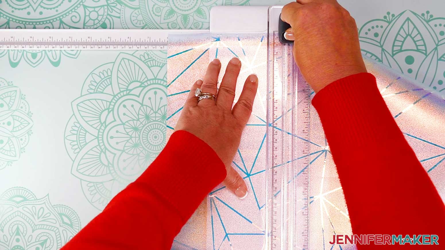 Use the portable trimmer to cut the window cling material.