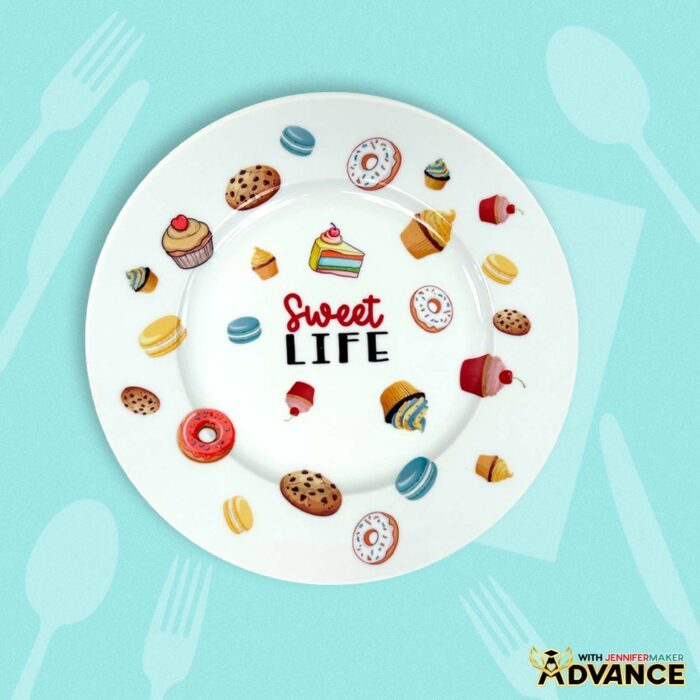 A customized plate decorated with waterslide decals of baked goods that says "Sweet Life" as part of the Waterslide Decals For Beginners tutorial in the ADVANCE with JenniferMaker program