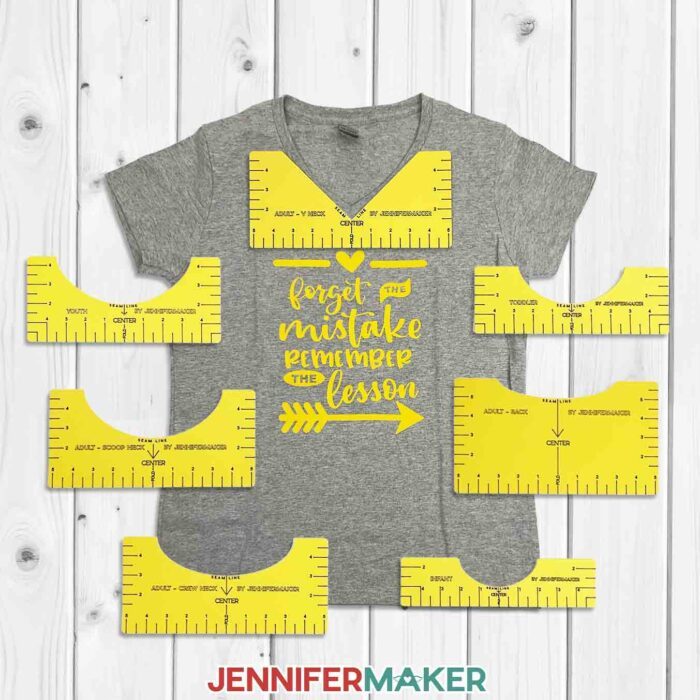 T-shirt rulers on a gray shirt with yellow vinyl that reads, "Forget the mistake remember the lesson"