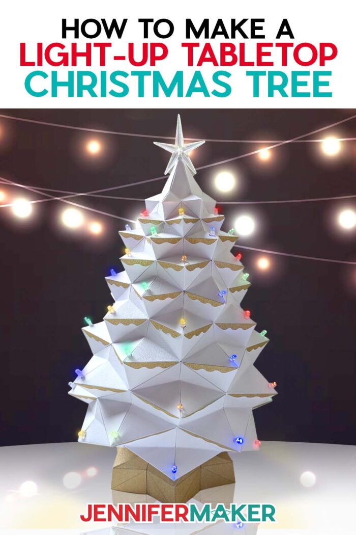 Learn how to make a light-up tabletop Christmas tree for the holidays with JenniferMaker's tutorial! An elaborate white cardstock Christmas tree glows with multicolored lights against a dark backdrop studded in twinkle lights.