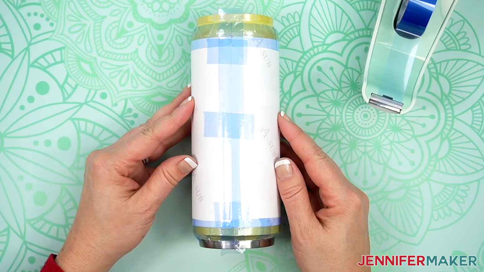 Heat resistant tape applied to sublimation print around tumbler