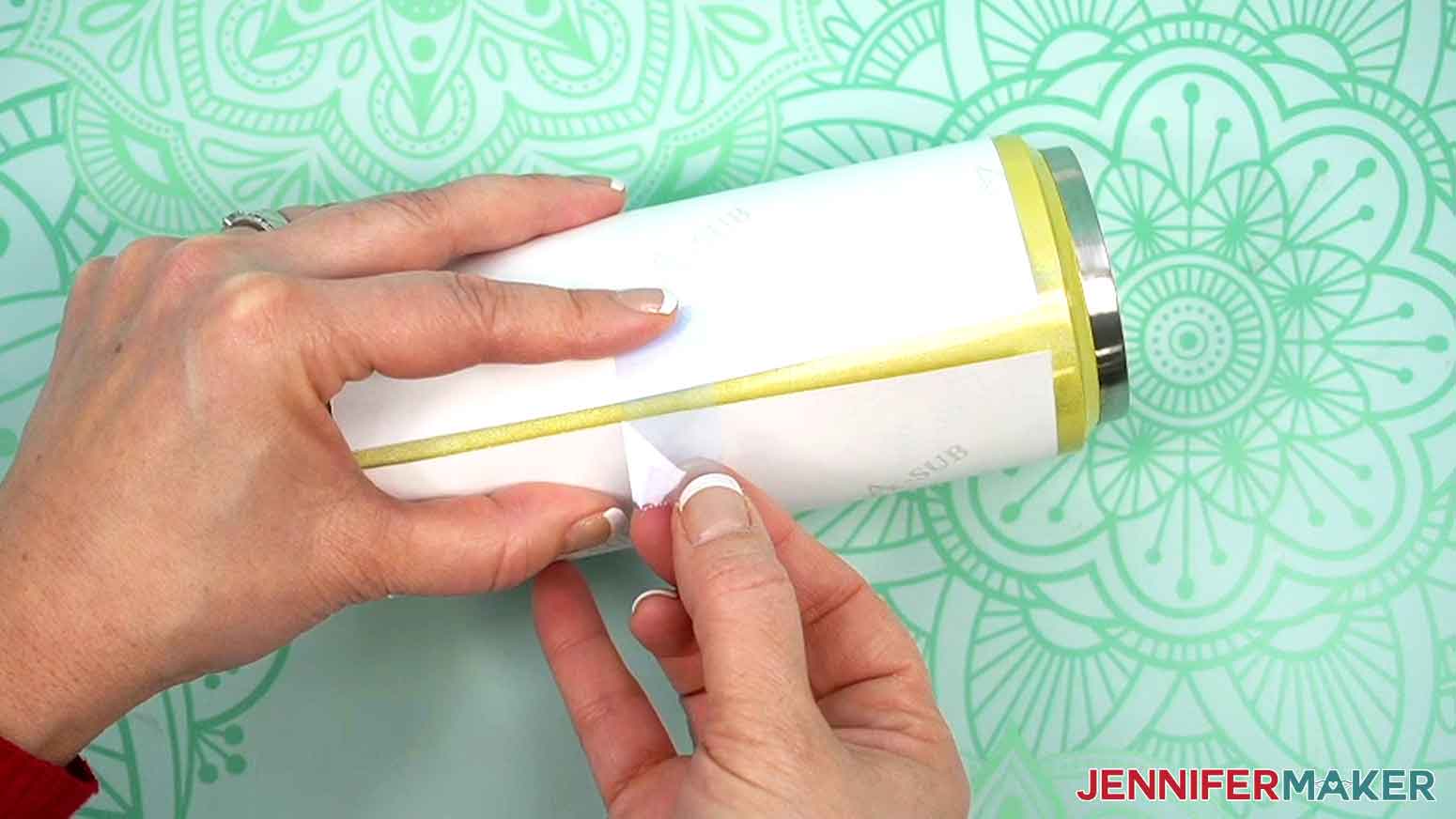 Heat resistant tape pulled over the seam in the middle of paper on tumbler