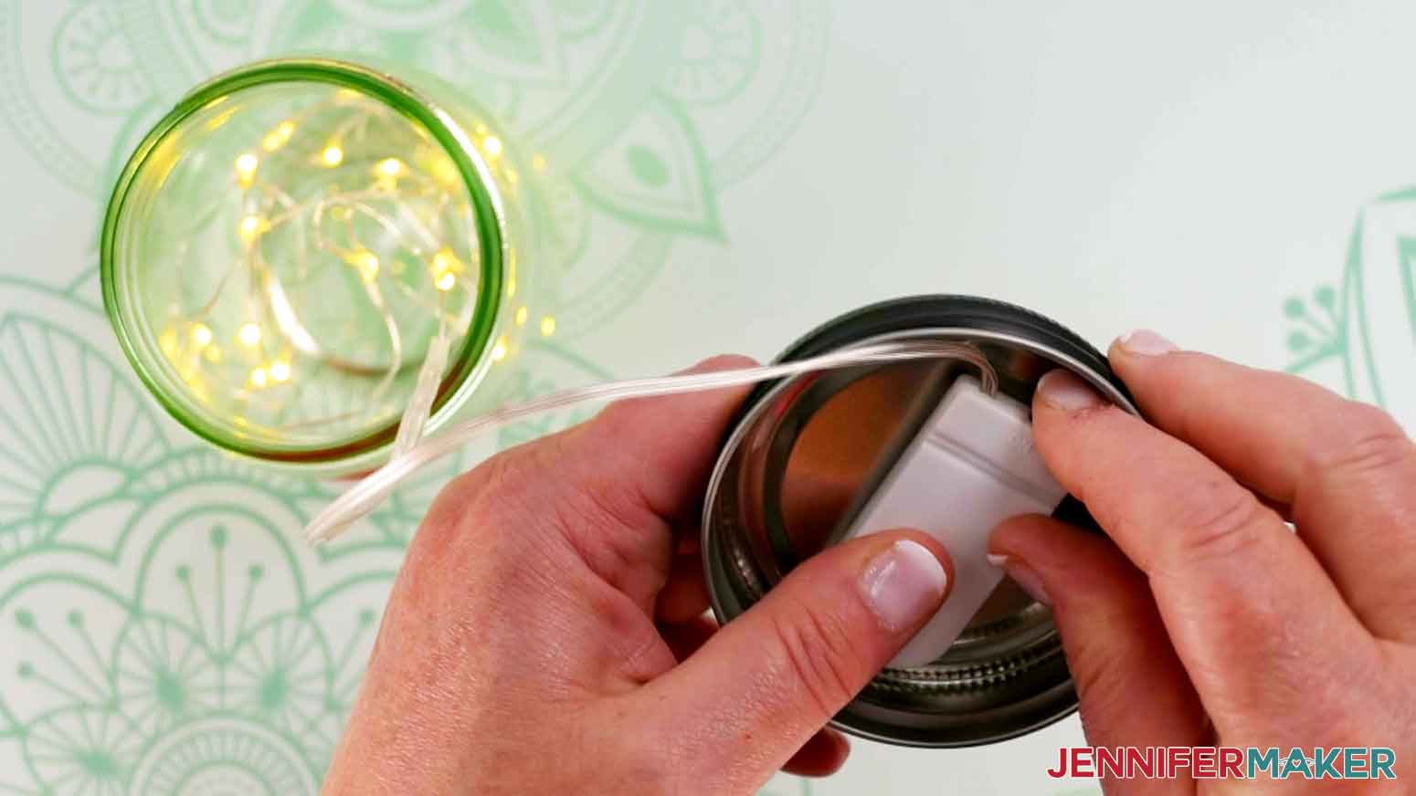 Apply fairy light battery switch to inside of mason jar lid.