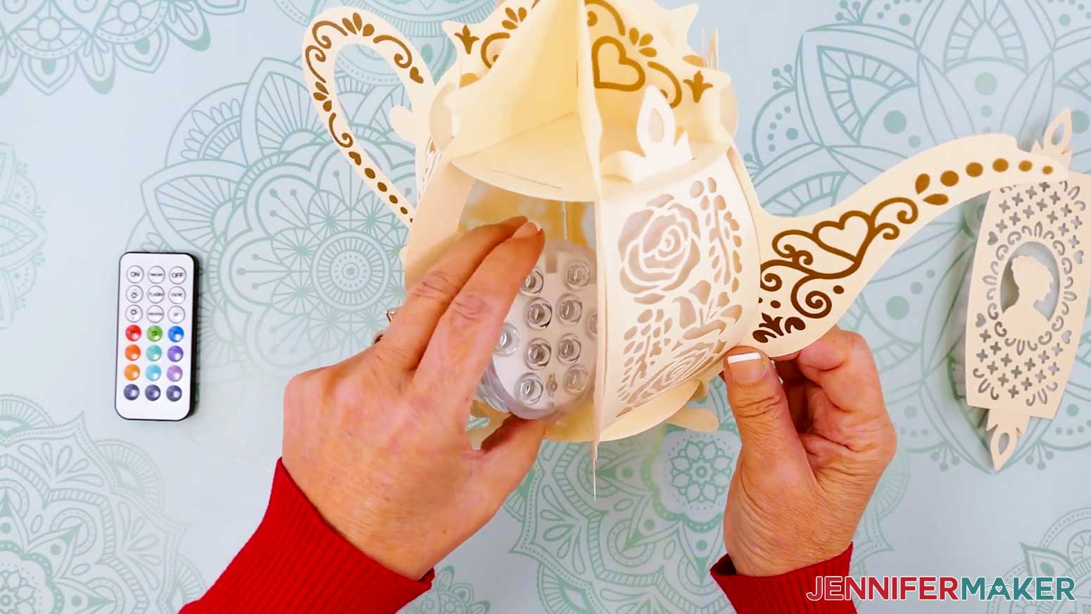 Place the LED puck light in the bottom of the teapot lantern base.