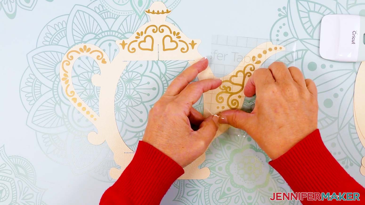 Apply the vinyl decals to the back side of the teapot lantern's main frame piece.