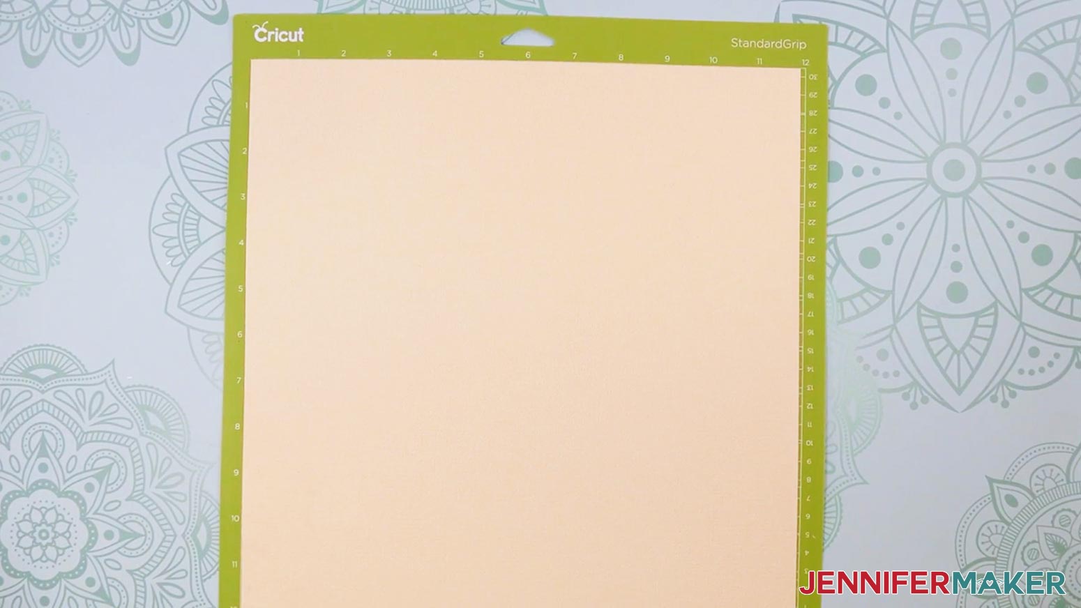 Place the cardstock face up on a green StandardGrip machine mat.
