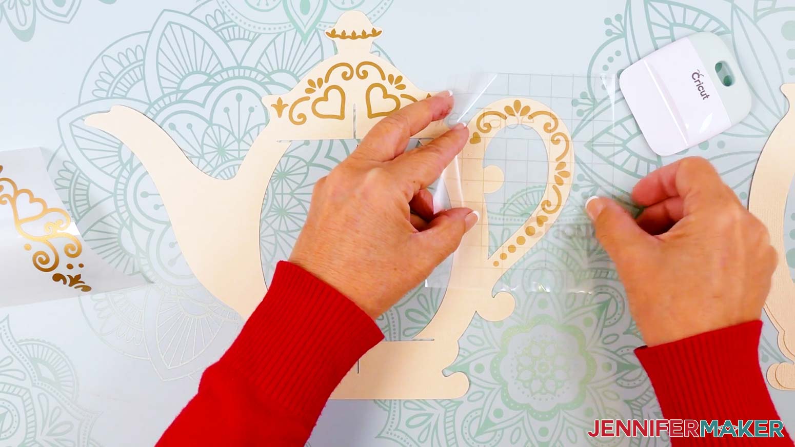 Apply the vinyl decal to the teapot lantern's handle section.