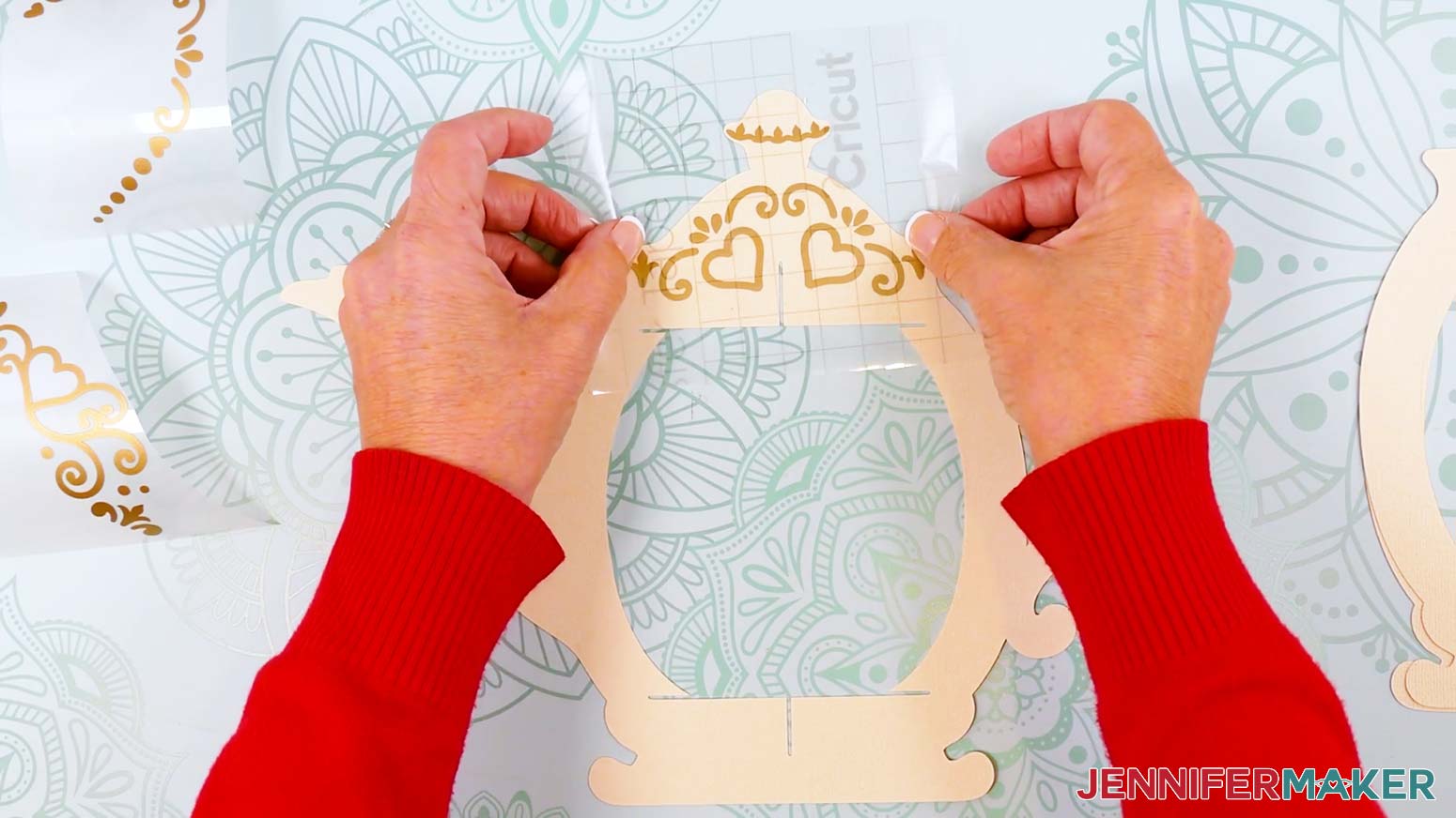 Position the decal over the lid area of the teapot lantern frame and gently lower it onto the cardstock.