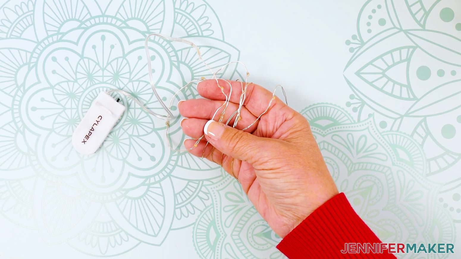 Loosely wrap the fairy lights wire around your fingers to make a coil.
