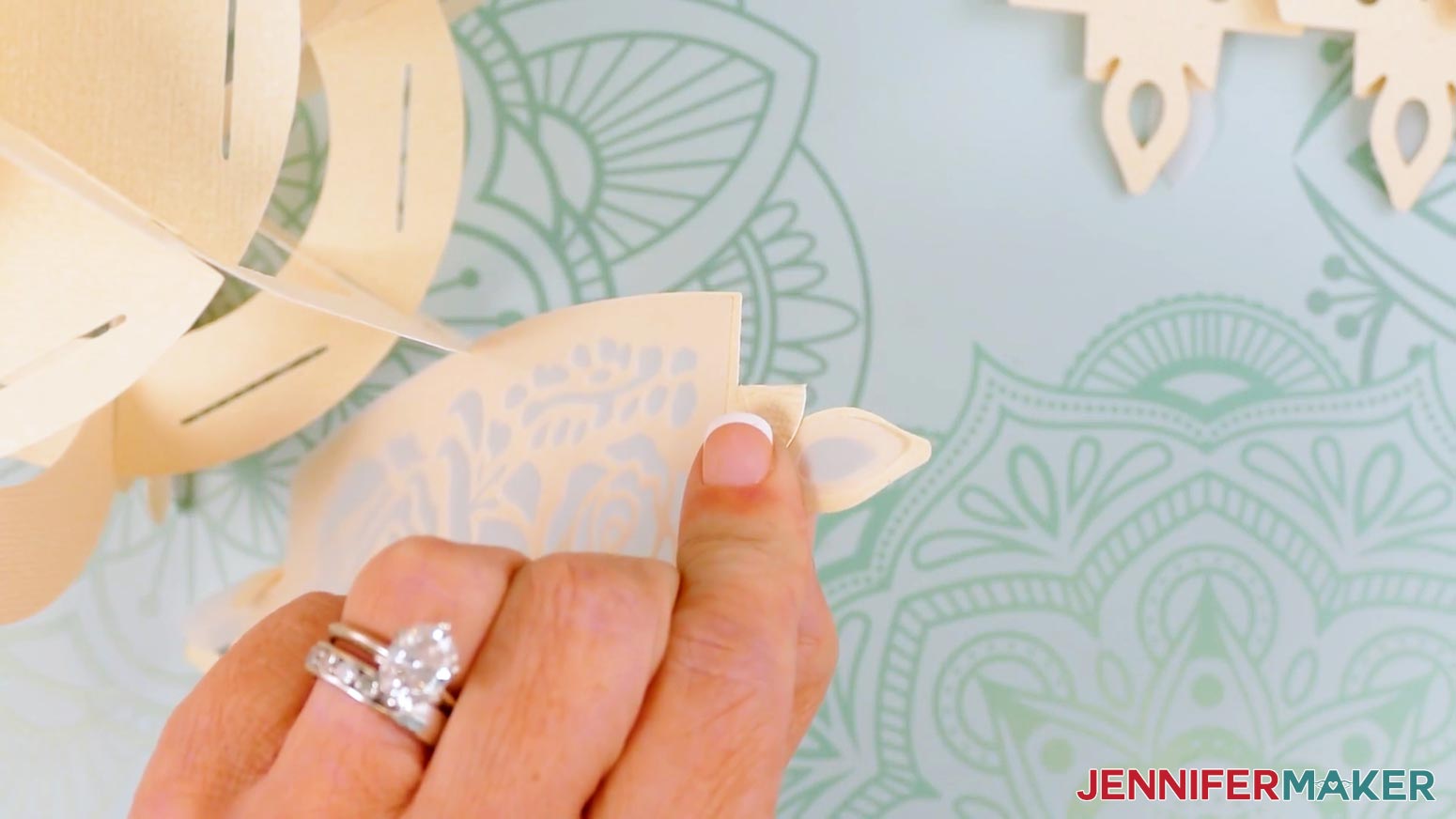 Pinch the cardstock wings and the tip of the vellum panel for the teapot lantern.