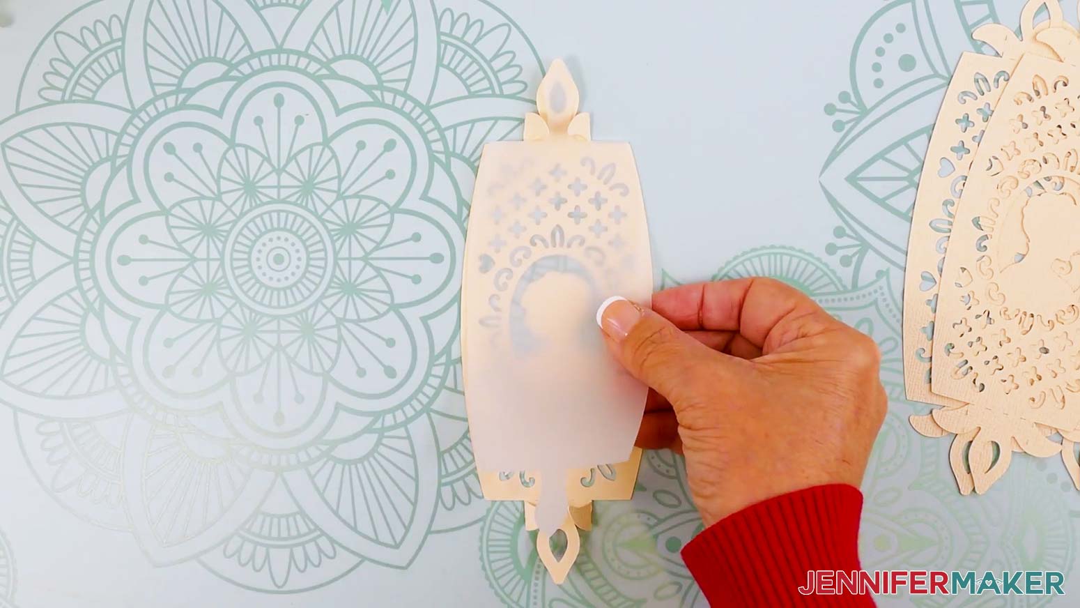 Insert a vellum diffuser piece onto the back of the folded cardstock panel, using the wings to hold it in place.