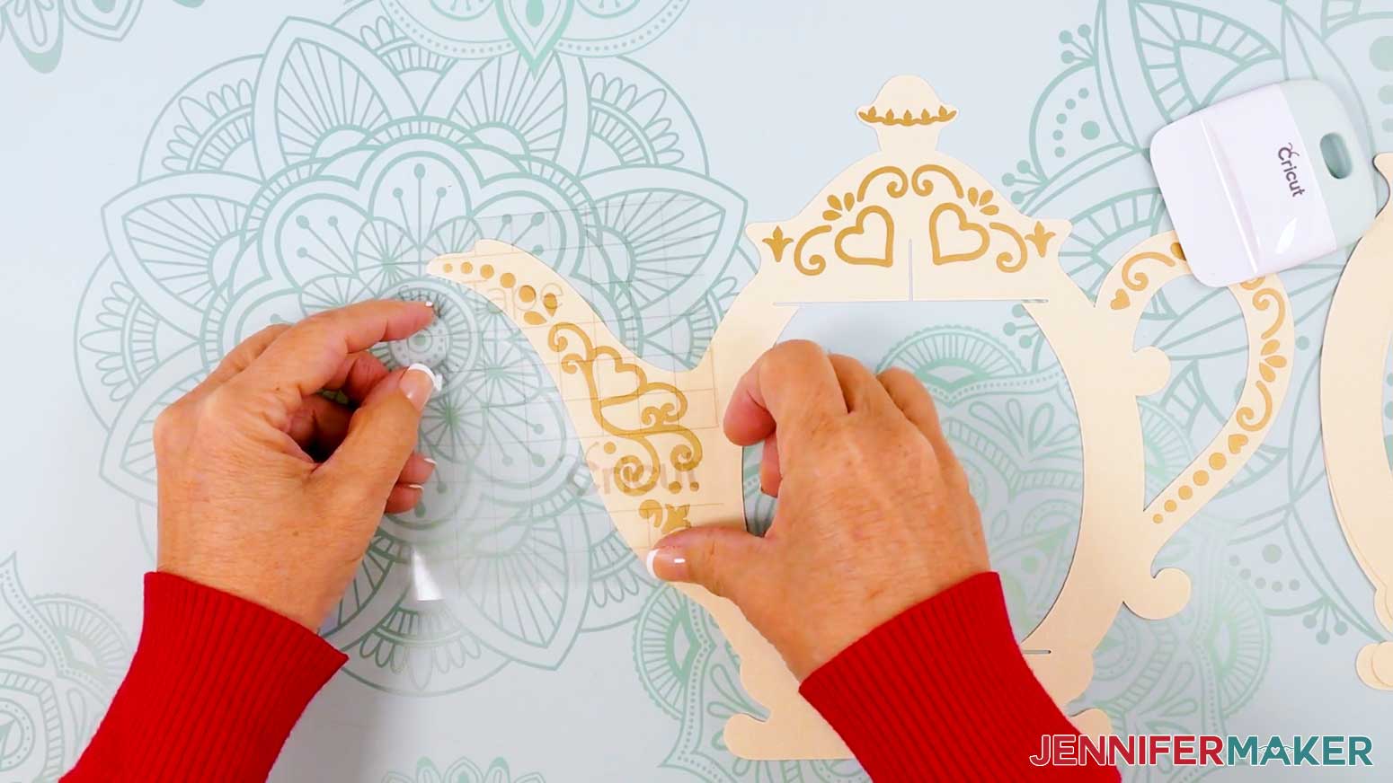 Apply the vinyl decal to the teapot lantern's spout section.