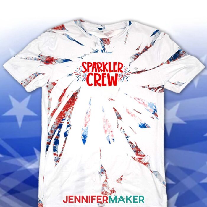 Learn how to make Red White and Blue Tie Dye sublimation T-shirts with JenniferMaker's tutorial! A sublimated tie dye shirt with a design reading "Sparkler Crew."