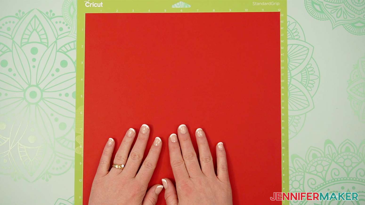 Place the cardstock for the tower gift box on a green machine mat.