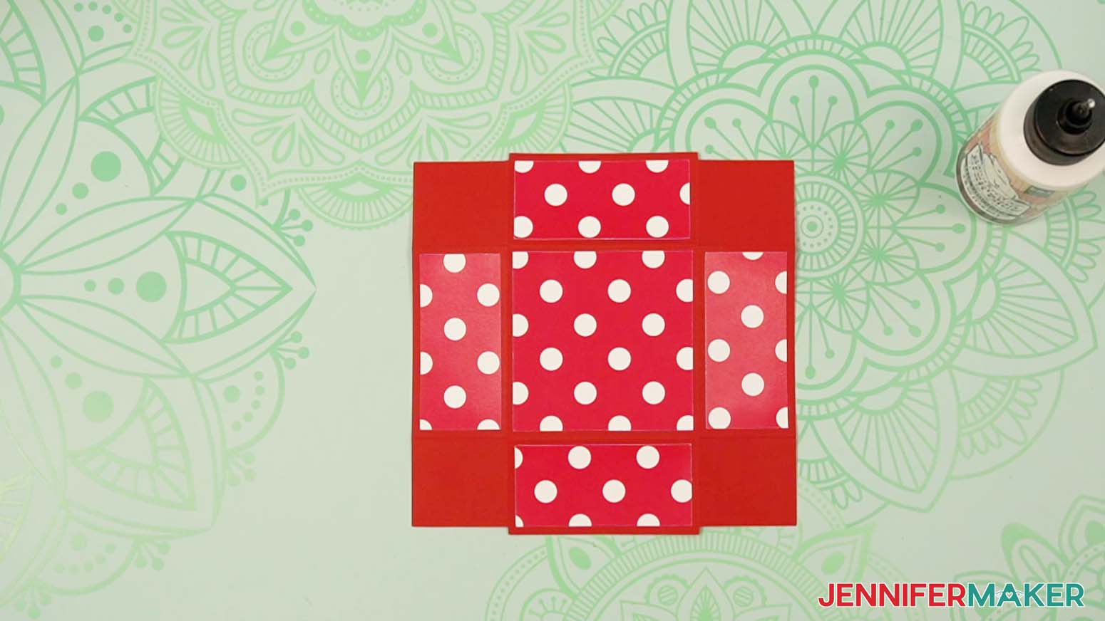 Apply the top decorative piece to the tower gift box lid.