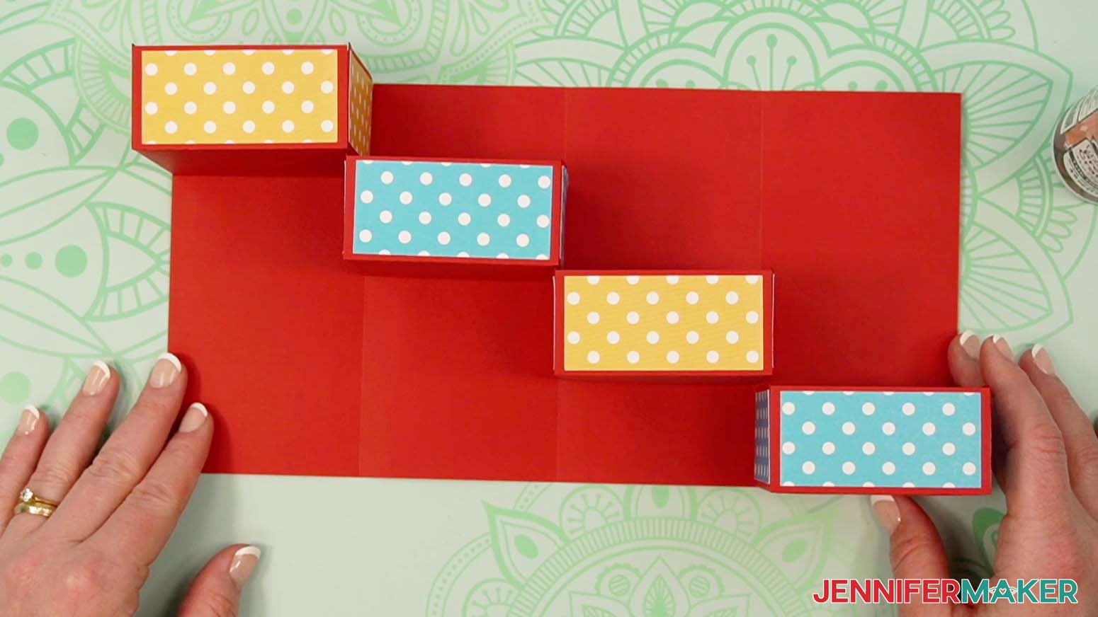 Adhere the fourth drawer to the tower gift box.