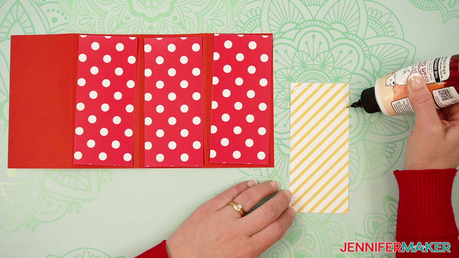 Glue the outer decorative panels to the body of the tower gift box.