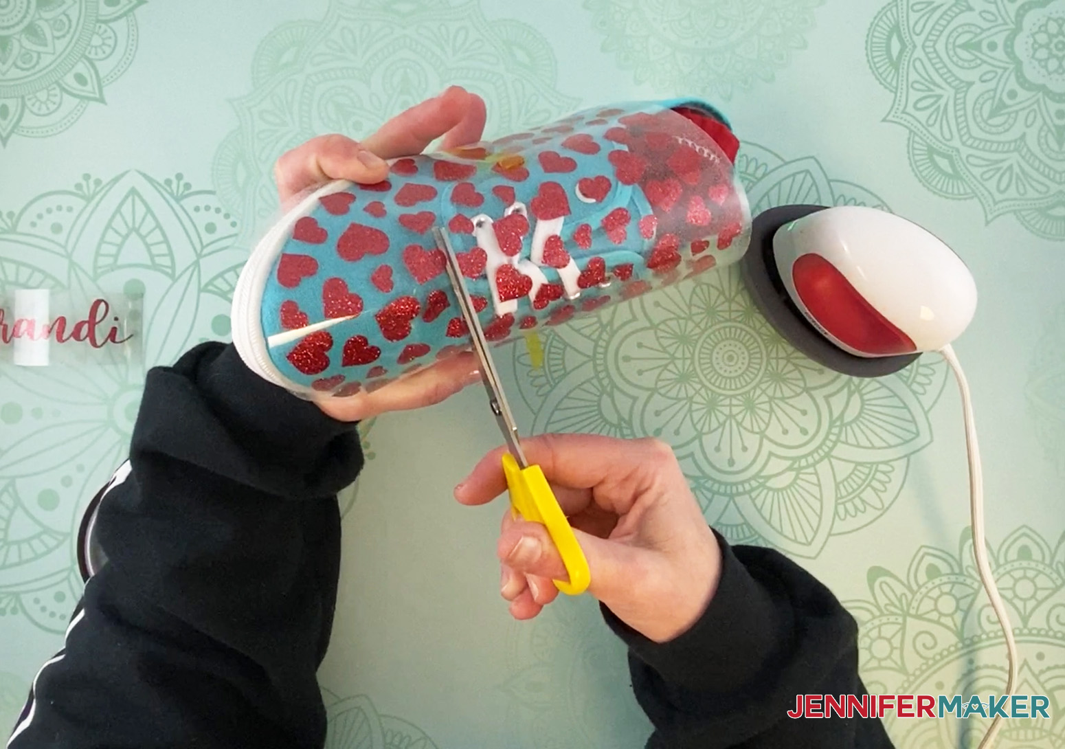 Trim off excess vinyl design before ironing to upcycle sneakers