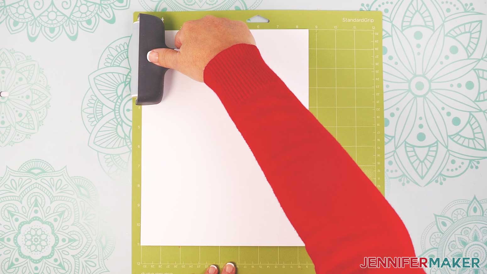 Using a brayer, make sure cardstock is attached to standard grip green Cricut mat.