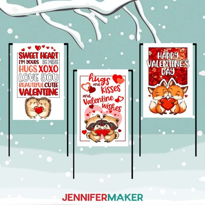 Learn to sublimate cute Valentine Flags with JenniferMaker's tutorial! Three Valentine's Day flags with sweet sayings and cute hedgehogs, raccoons, and foxes are propped up on a snowy background.