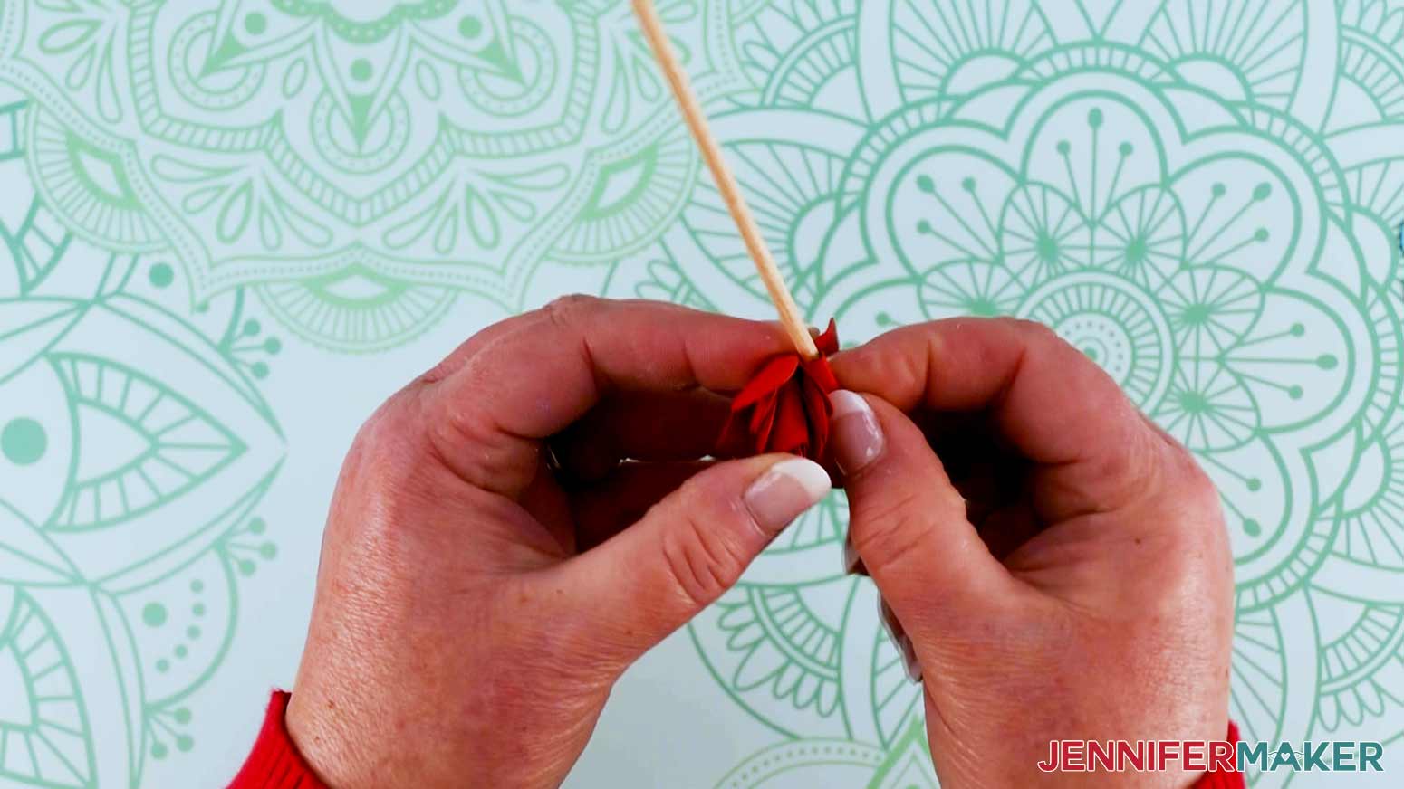 Use a wooden dowel to roll paper flower petals