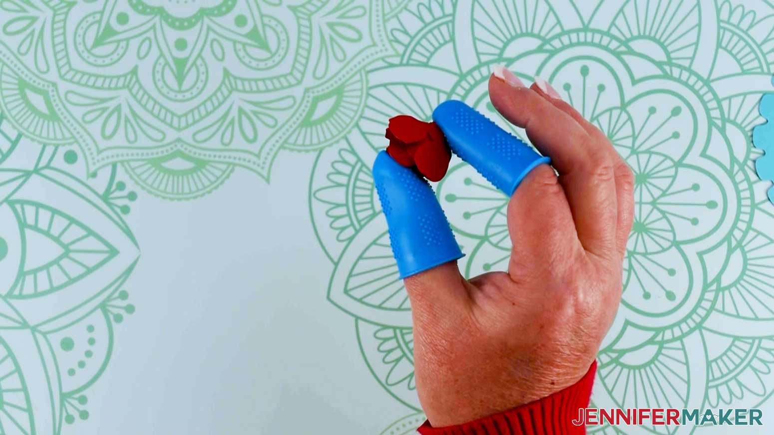 Press and hold the bottom of the paper flower with finger protection