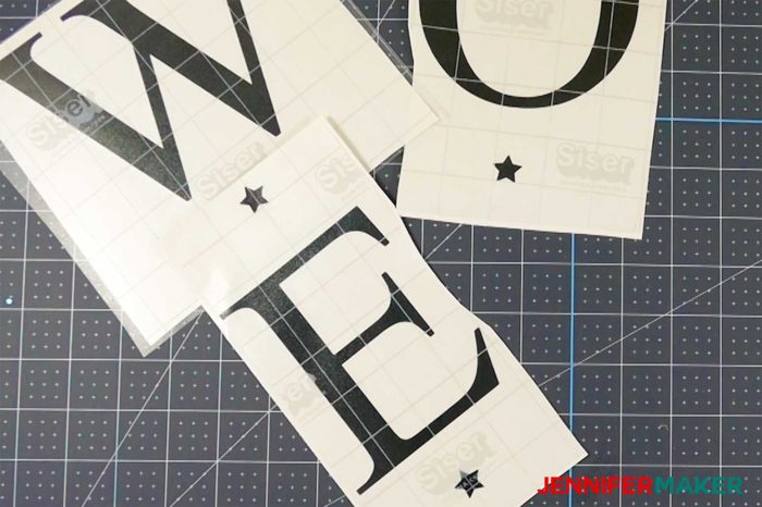 Separated vinyl letters cut out for a vertical welcome sign