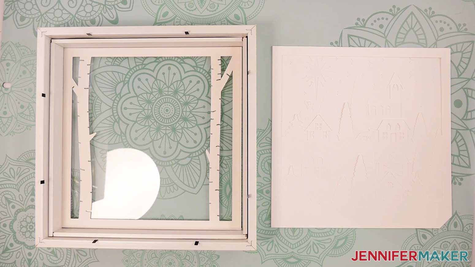 Add layer 1 of the Village Shadow Box With Lights to the frame.