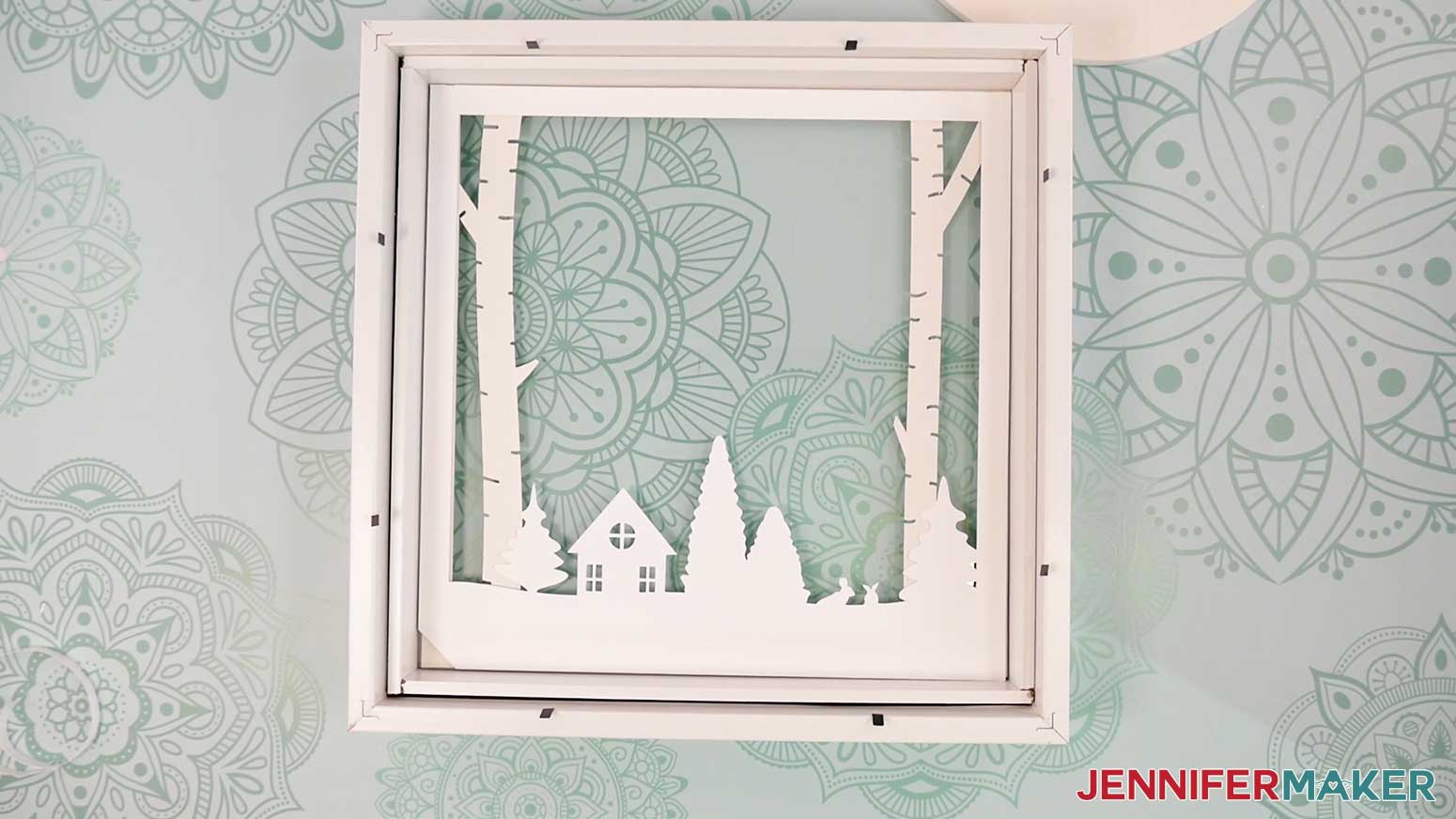 Layer two is applied to the back of Layer 1 of the Village Shadow Box With Lights.