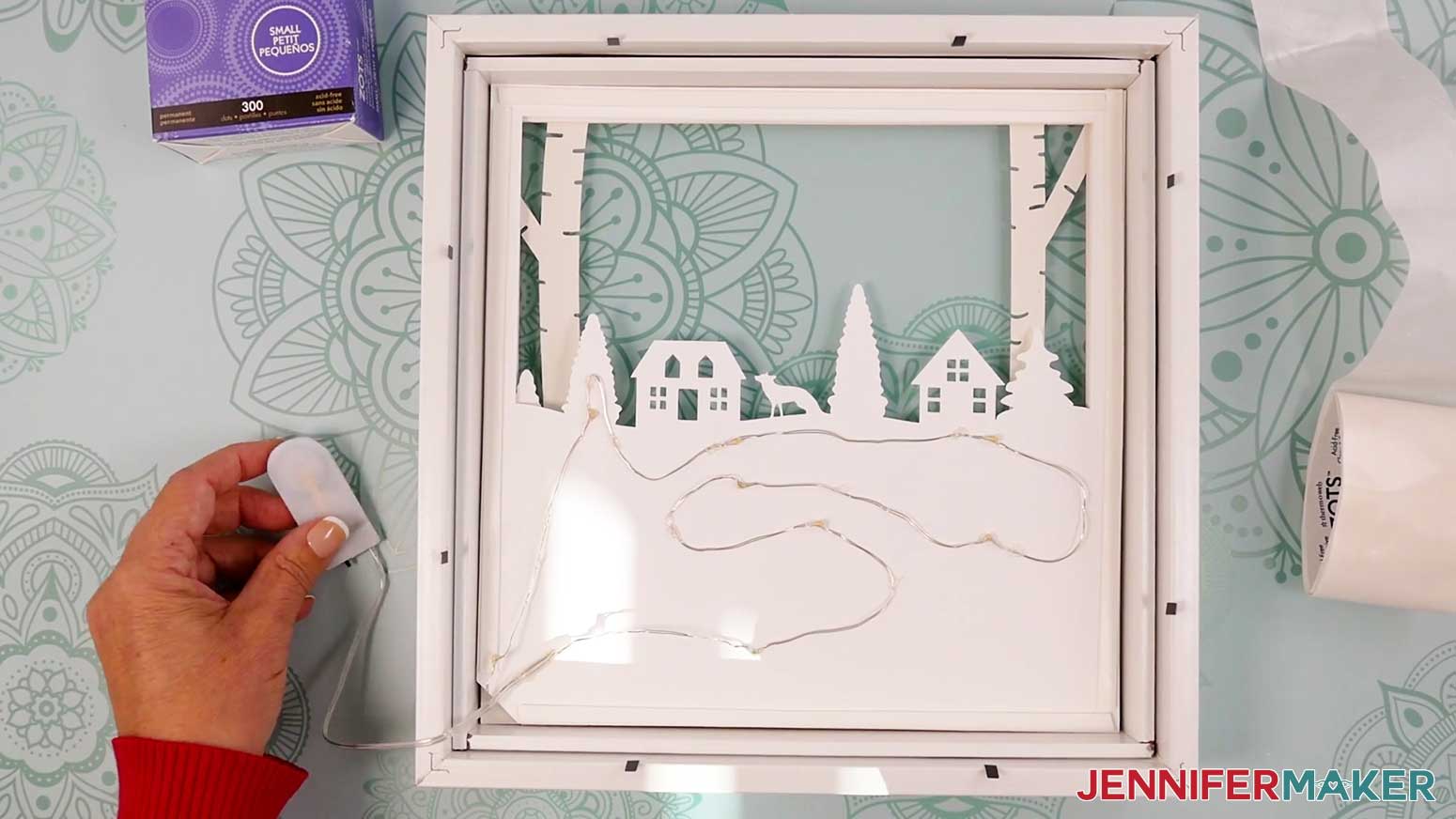 Add the light strip to the back of Layer 4 of the Village Shadow Box With Lights.