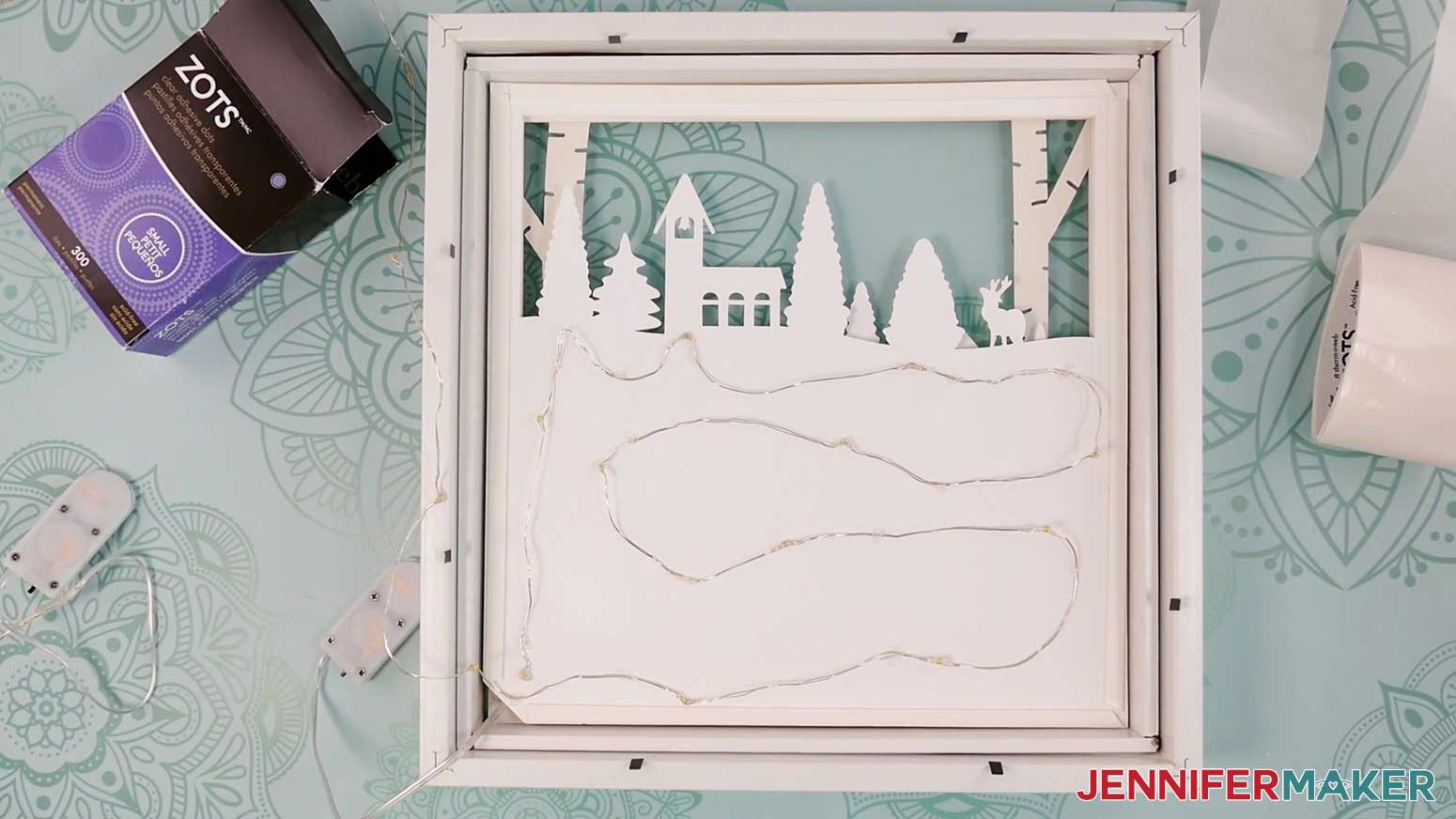 Add the light strips to the back of Layer 5 of the Village Shadow Box With Lights.