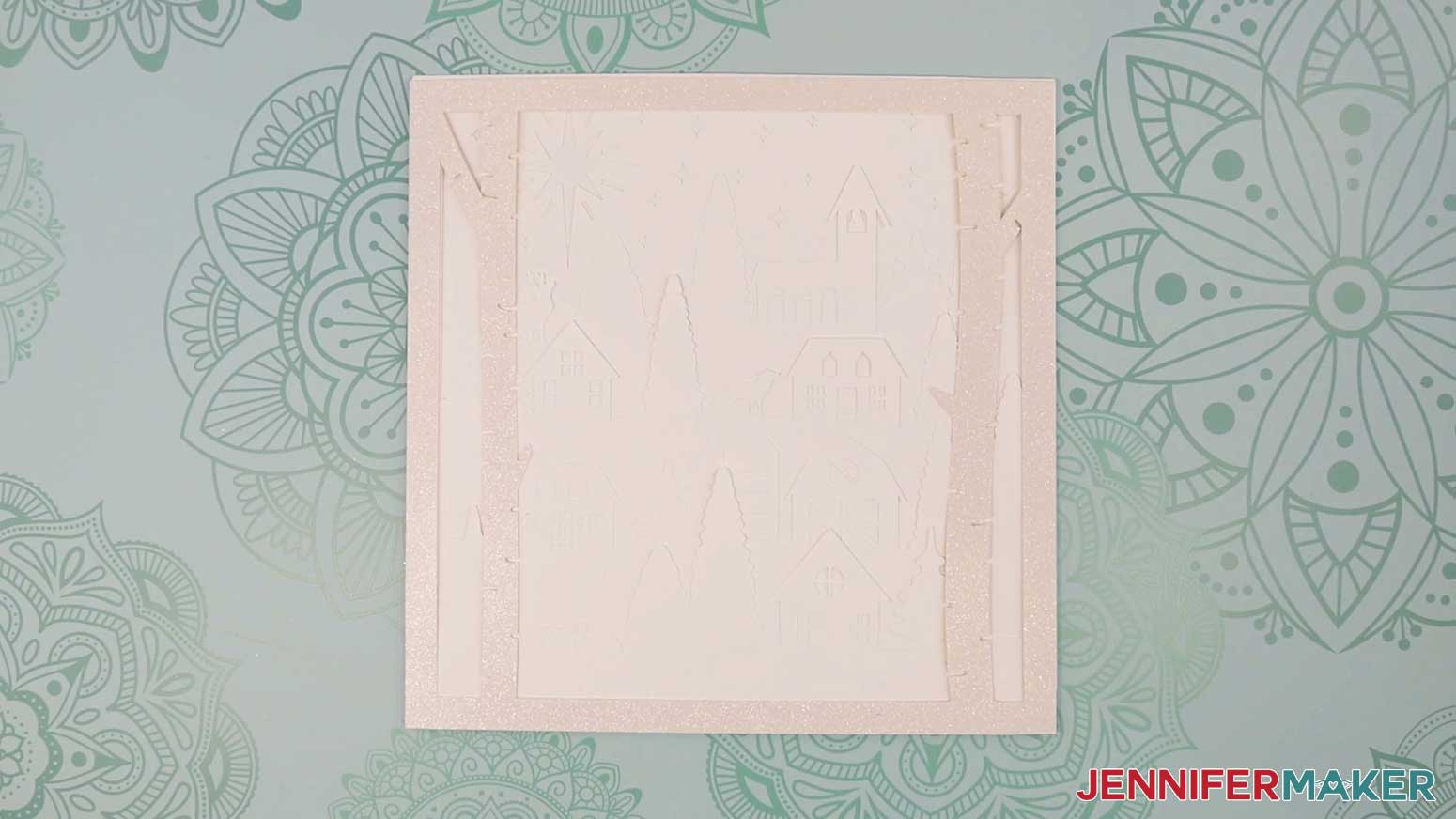 Stack all the cut layers for the Village Shadow Box With Lights in order.