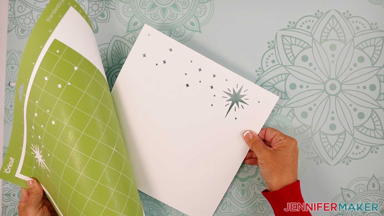 Roll the mat away from the cut pieces for the Village Shadow Box With Lights.