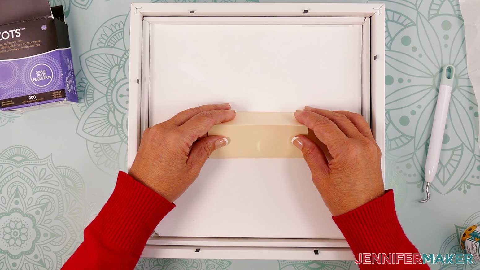 Glue the paper spacer to the back of Layer 7 of the Village Shadow Box With Lights.