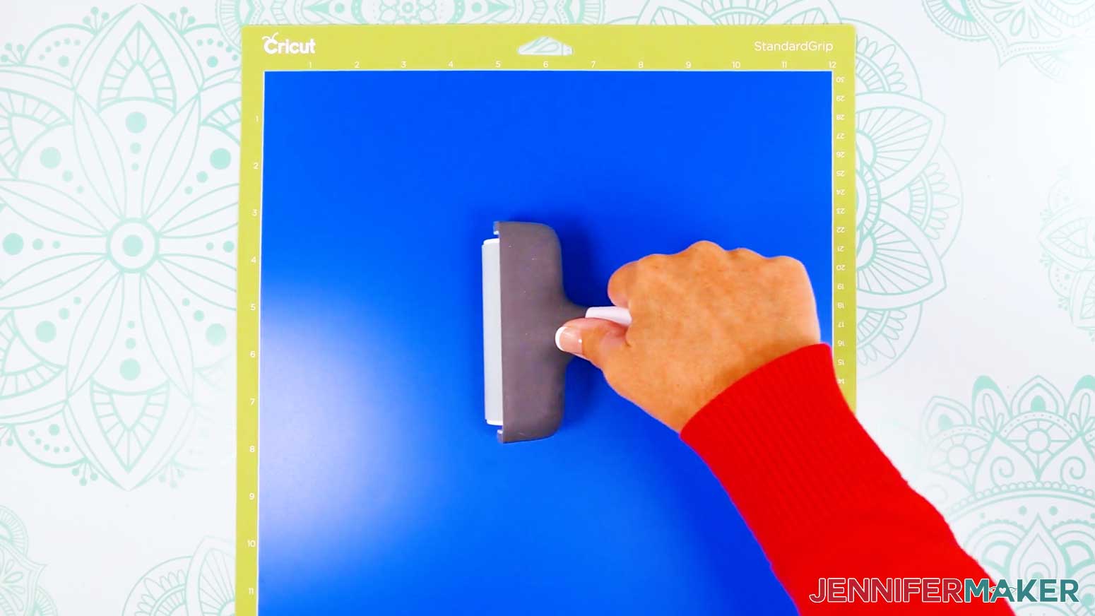 Use a brayer to roll the vinyl being cut onto the machine mat when cutting the vinyl vs iron on design.