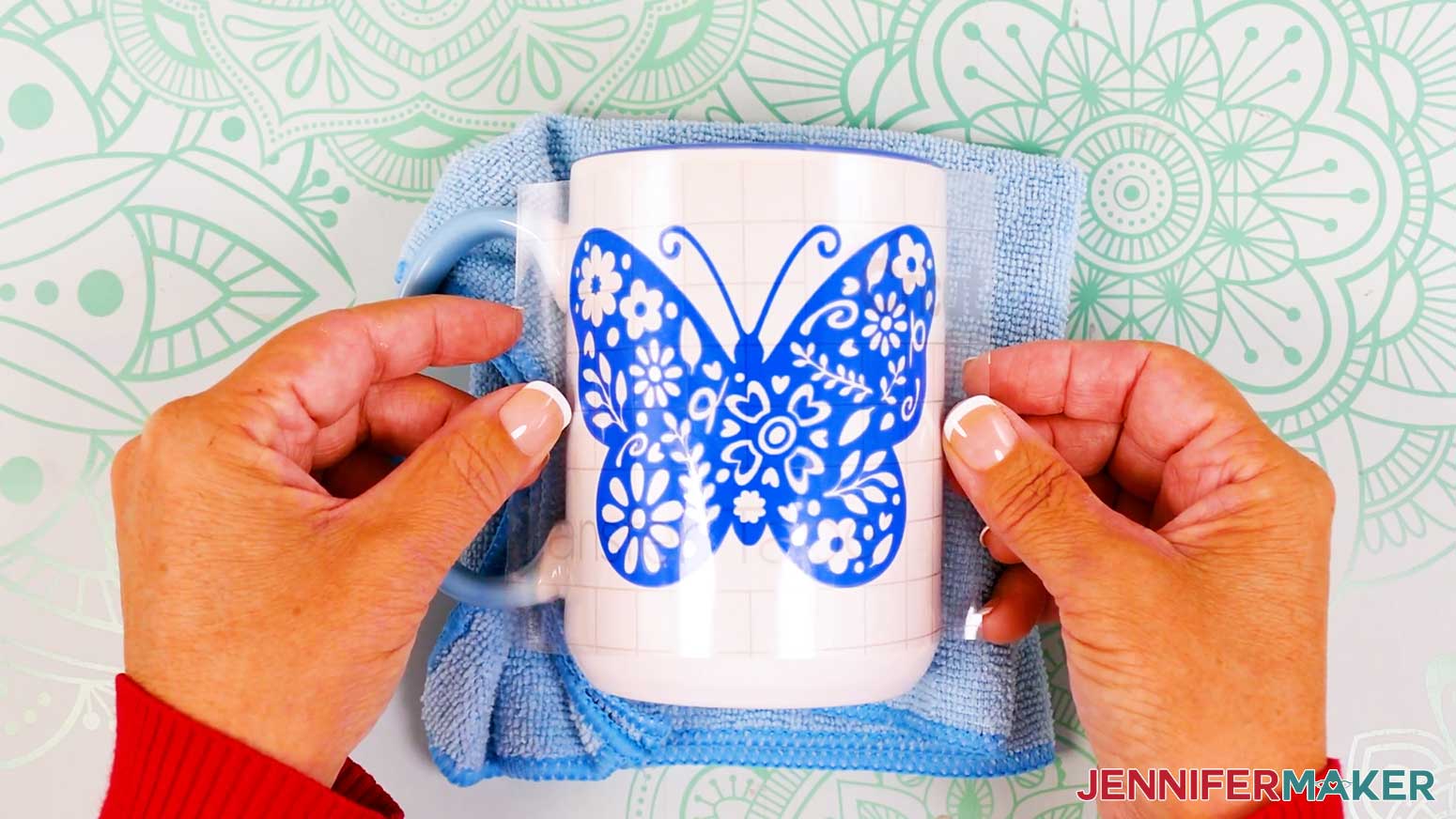 Roll the butterfly vinyl vs iron on design onto the mug.