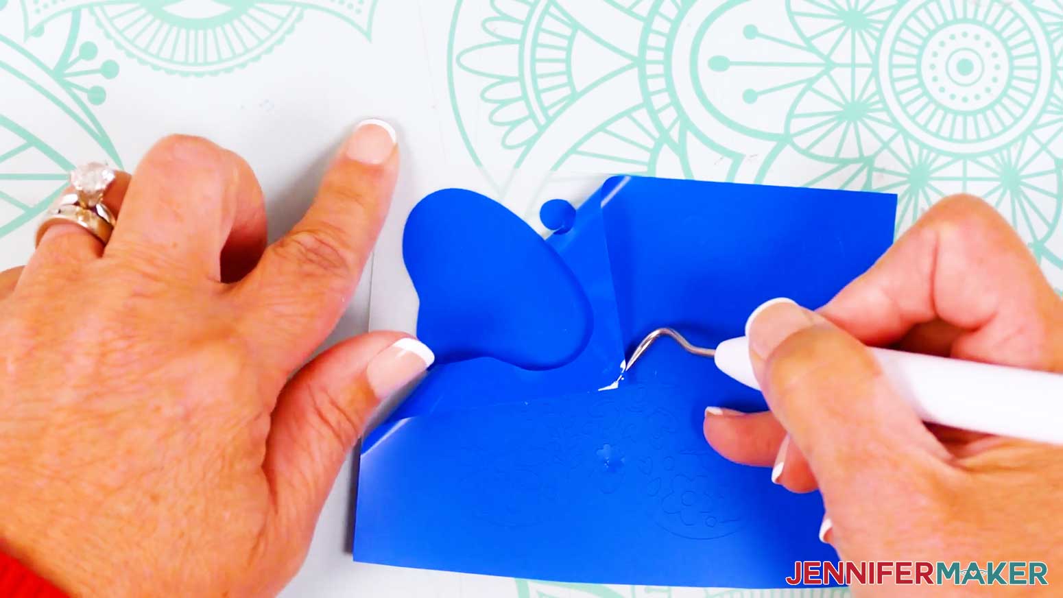 Carefully weed the extra material away from the vinyl vs iron on design.