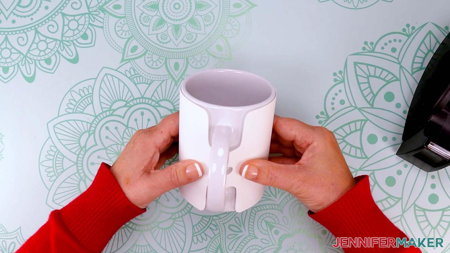 With the drawing facing up and toward the mug and oriented correctly, wrap the design tightly around the mug with the ends coming together under the handle.