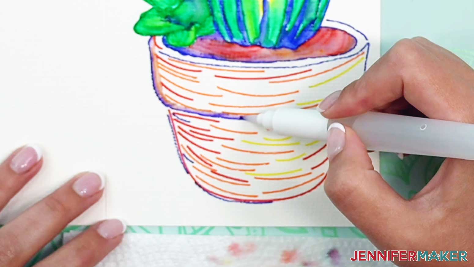 Color in the blue line around the top of the pot to create a shadow area on the watercolor cactus pot.