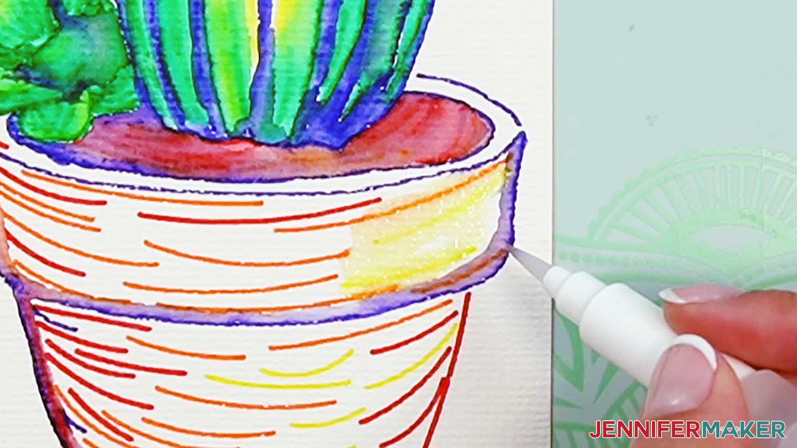 Blend the yellow areas on the pot together to form highlights on the watercolor cactus pot.