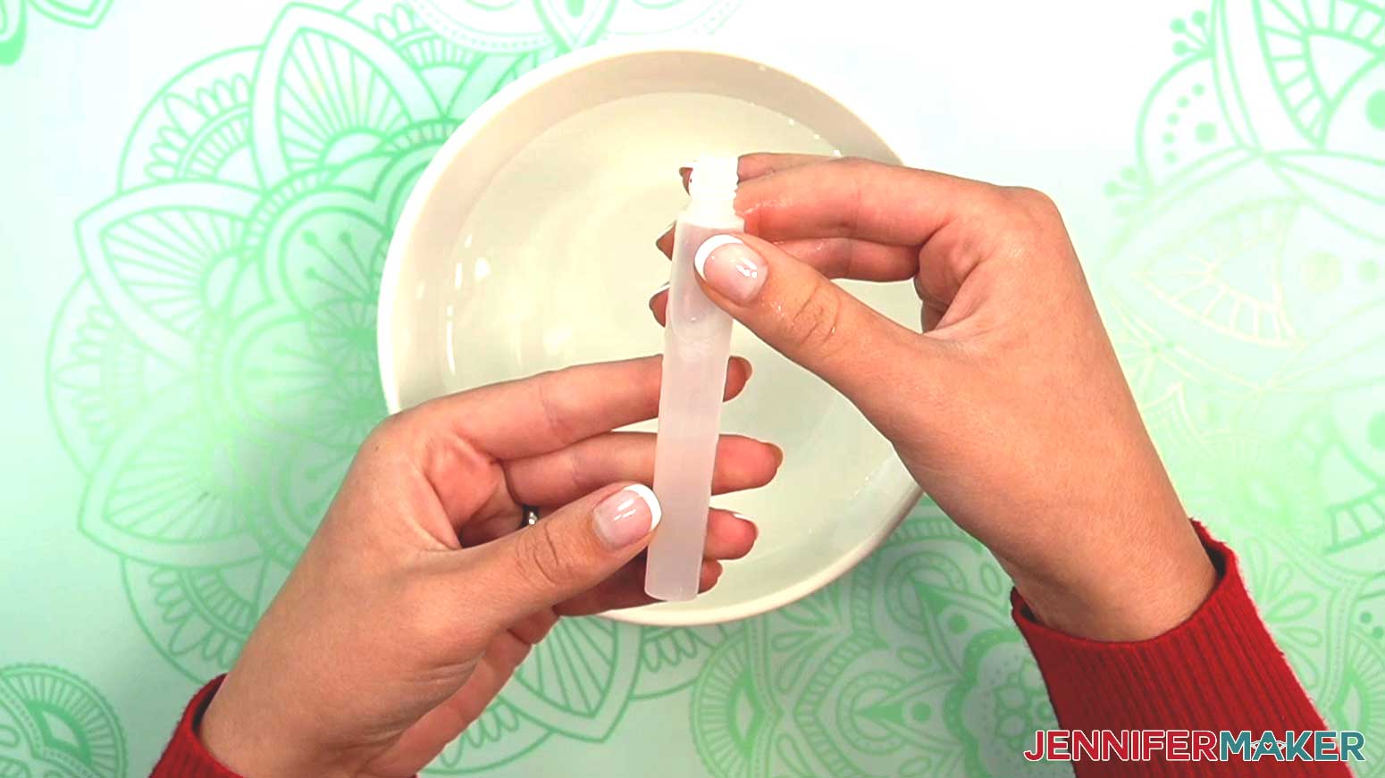 Fill the watercolor brush tube by holding it under water and gently squeezing the sides.