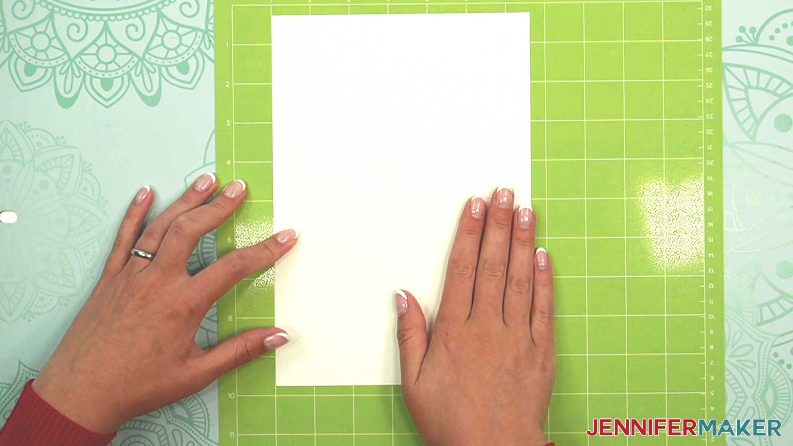 Place the watercolor card so the center crease and the left edge are lined with lines on the machine mat.