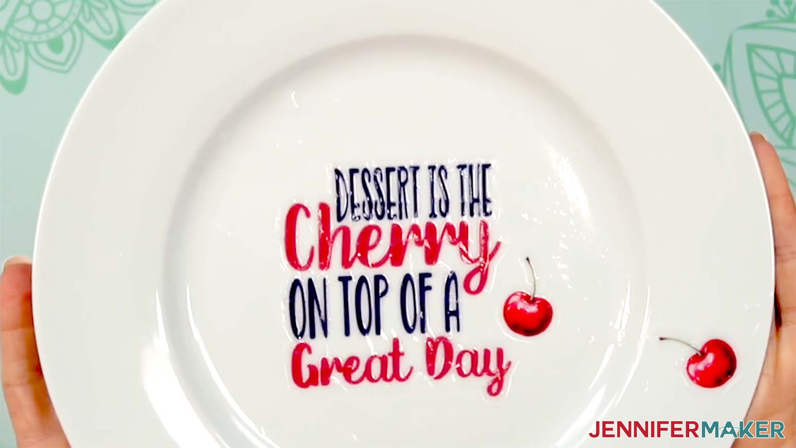 The cherry decals and cherry text decal have been applied to the flat portions of the plate.