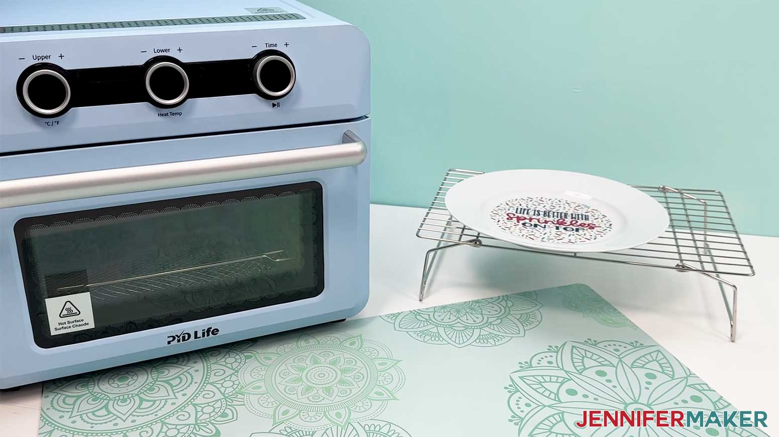 The plate that was sealed in the oven is shown cooling down in a rack by the oven.