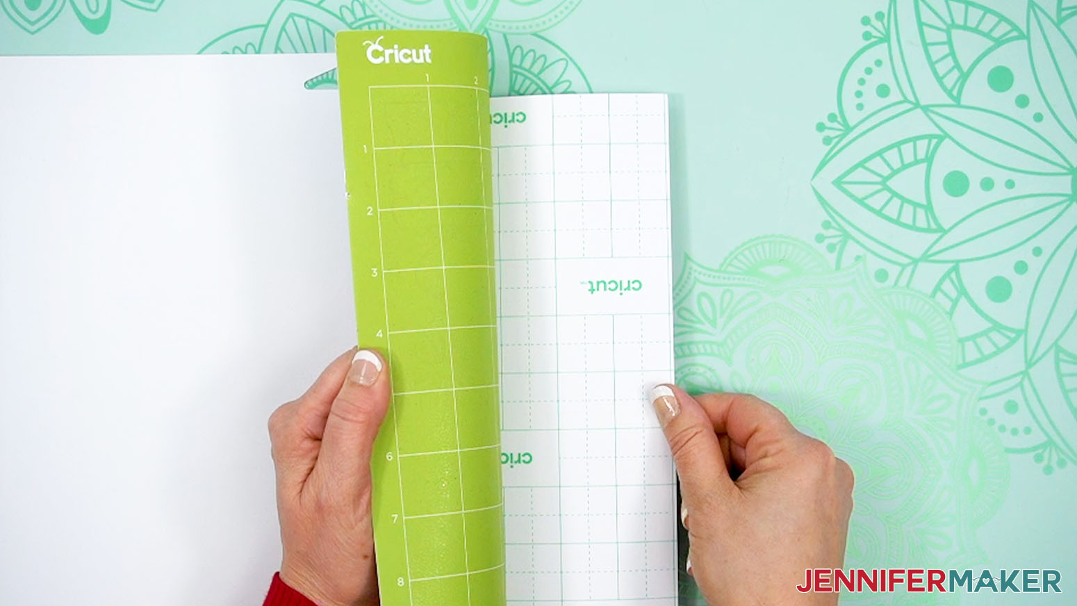 Flip over the mat and roll it away from the sticker paper.