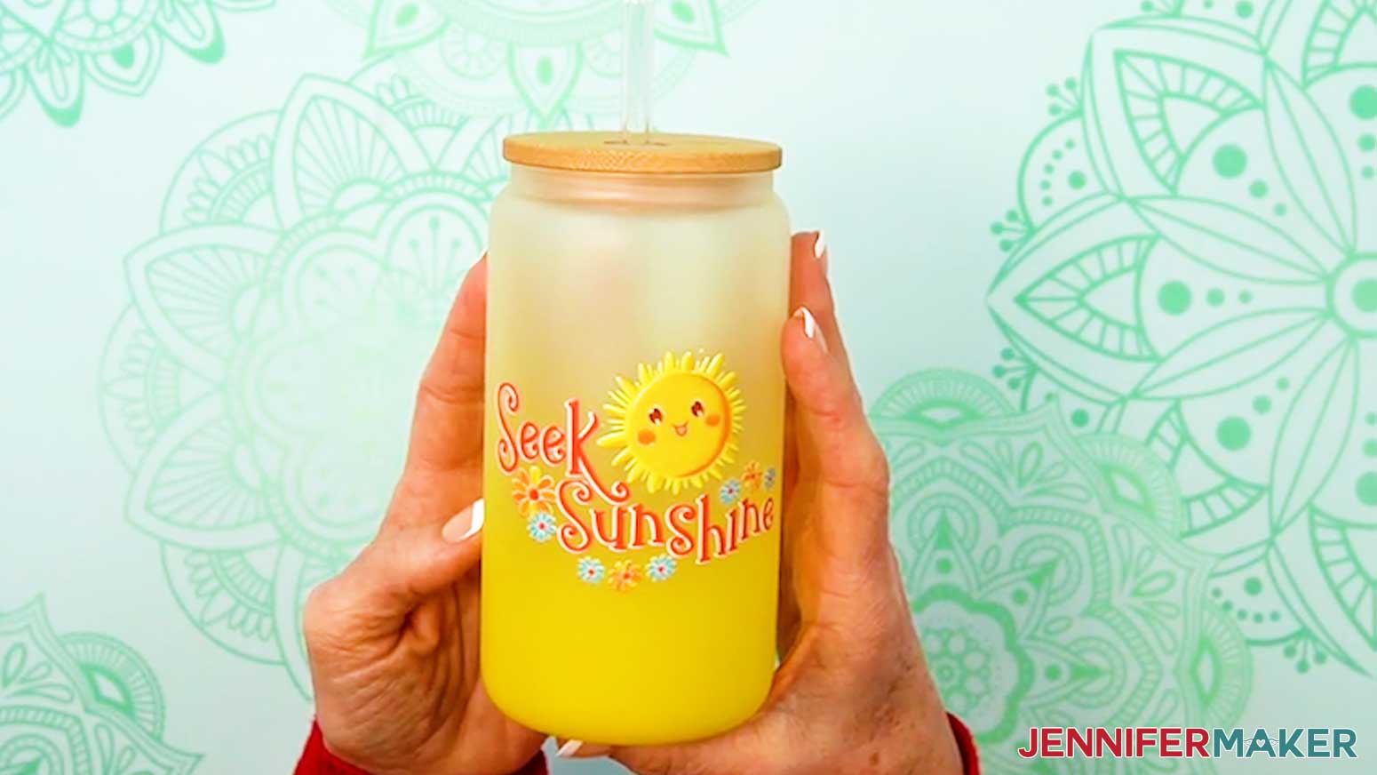 The UV DTF design is applied to the glass can.