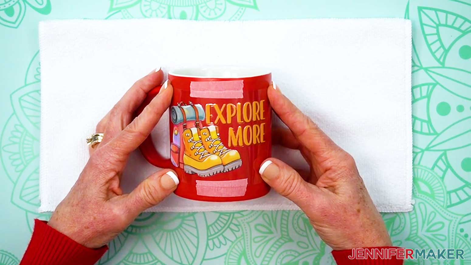 Place a piece of tape at both the top and bottom of the UV DTF design to hold it in place on the blank.
