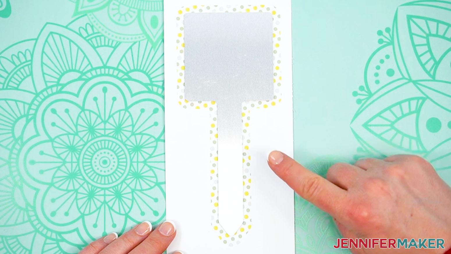 Center the blank sublimation garden stake face down over the print.