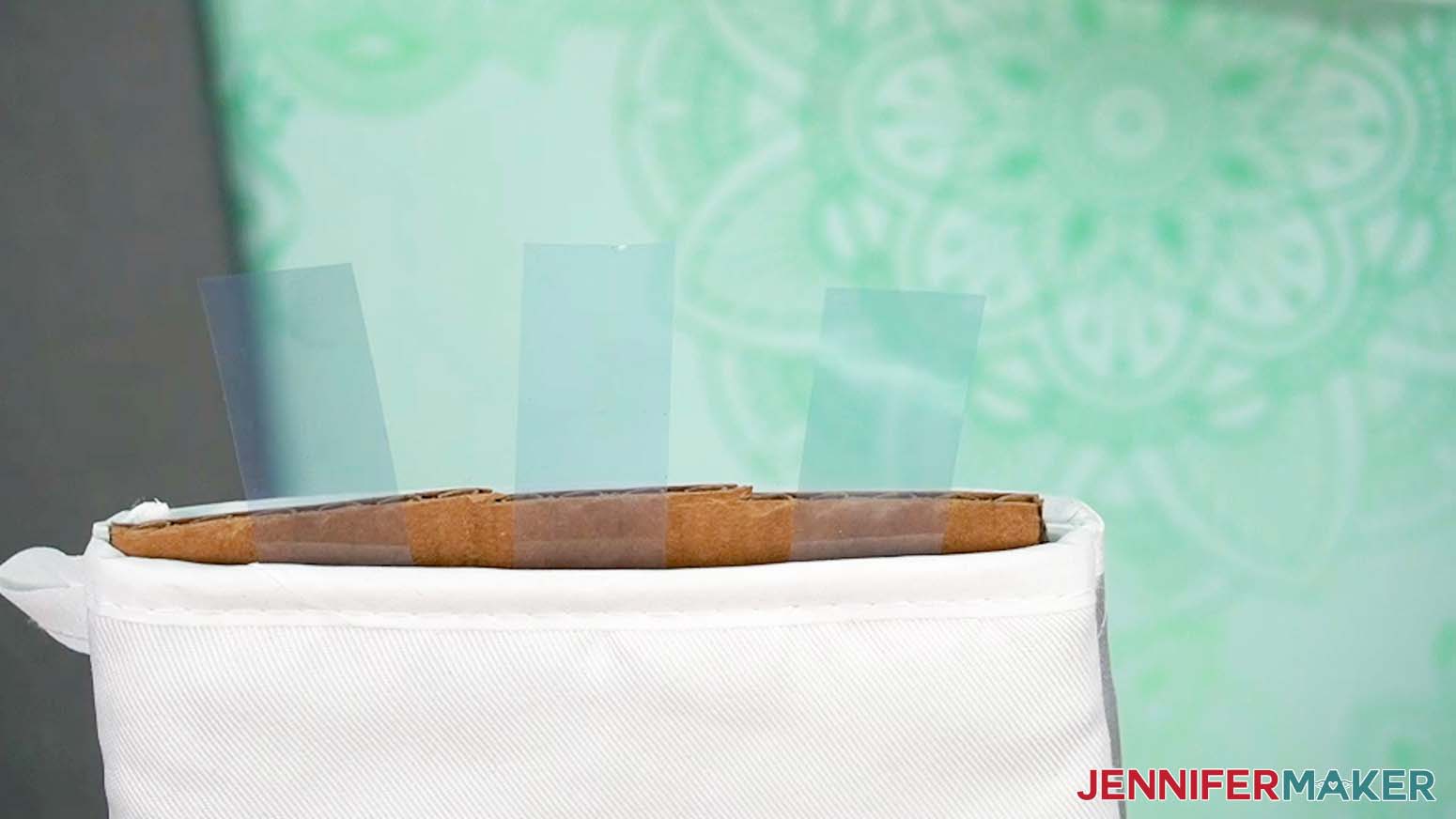 Add tape to the bottom edge of the insert while it is inside the sublimation oven mitt.